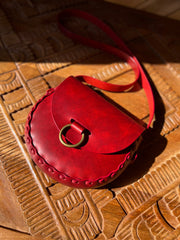 Crimson red leather bag with antique brass oring