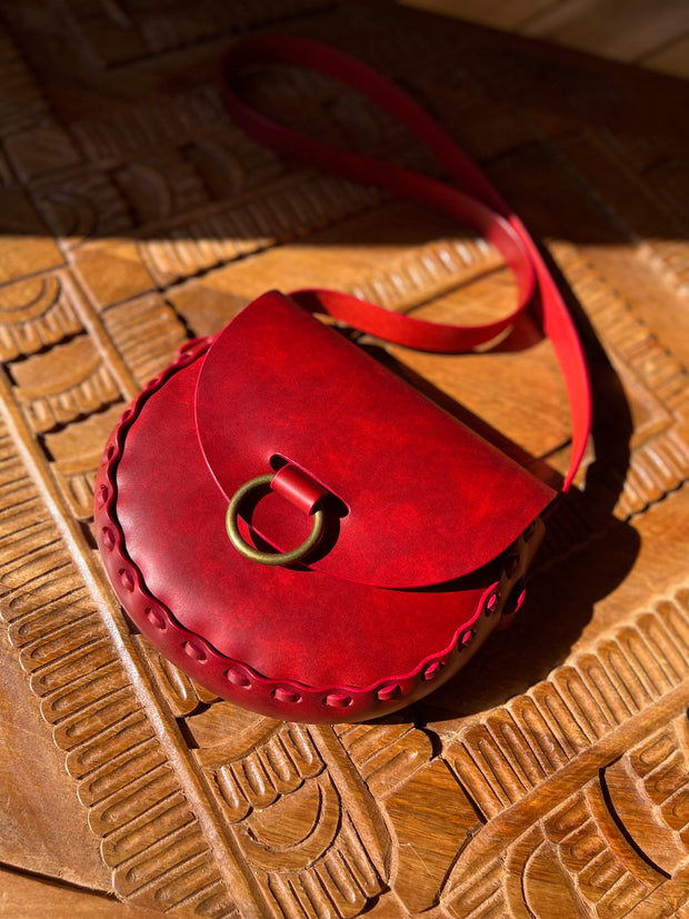 Crimson red leather bag with antique brass oring