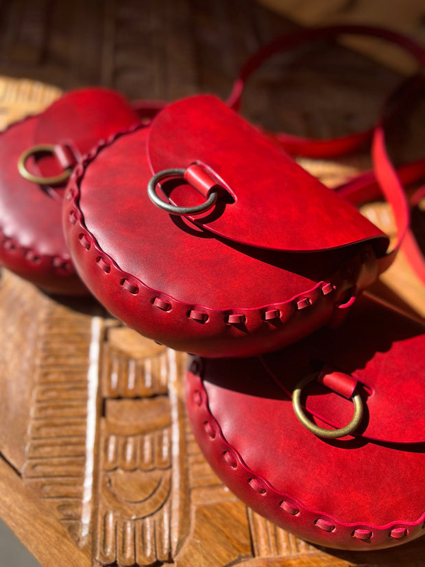 Trio of crimson red leather bags
